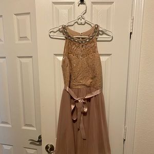 Special occasion dress. Size 7. Lace and rhinestones on top with pleated skirt.